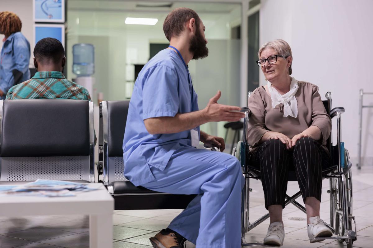 male-nurse-consulting-woman-with-chronic-disabilit