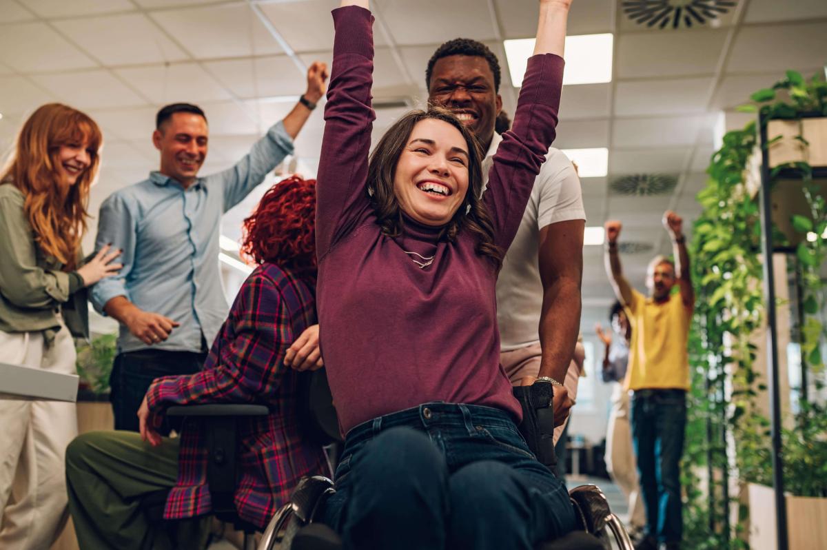 woman-who-uses-wheelchair-celebrating-winning