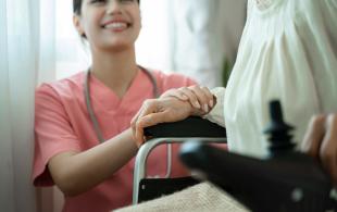 female-caregiver-holding-hands-lady